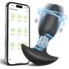 Massageador de próstata plug anal preto com bolinhas giratórias ao lado do celular com o aplicativo