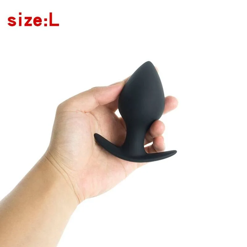 Plug anal pêssego tamanho L, 4,5 cm de diâmetro, na mão