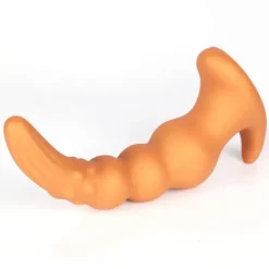 Plug anal grande dourado em silicone macio com corpo em contas e base larga em cauda