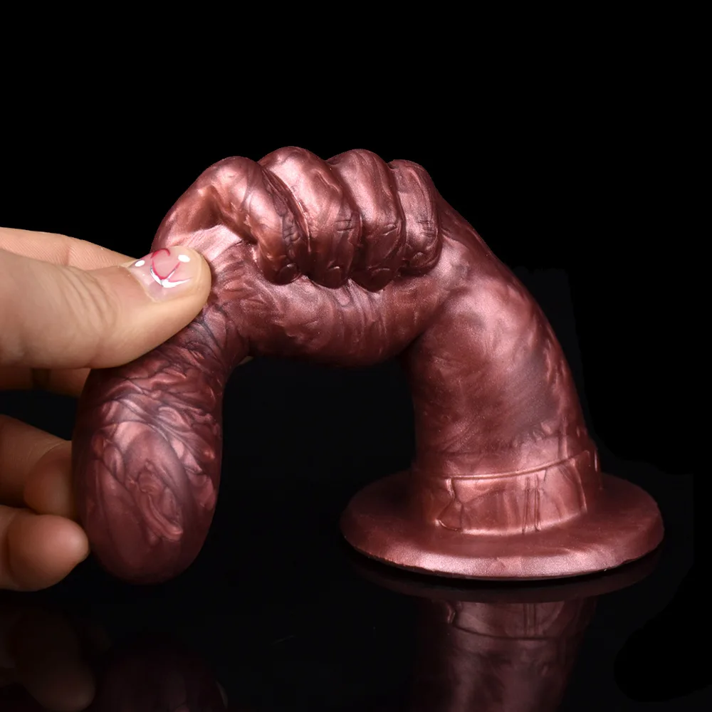 Plug anal dedão dobrado entre os dedos