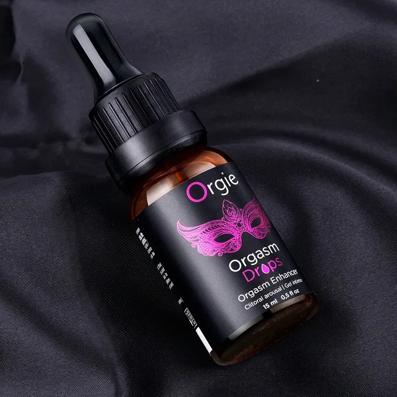 Frasco de 15 ml do Orgie Orgasm Drops sobre tecido preto