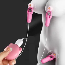 Clipe vibratório Pinkiry rosa preso nos mamilos e no clitóris com controle em forma de porquinho