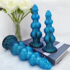 Detalhe da base em ventosa esculpida como pata do plug anal dog knot