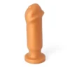 Plug anal com ponta em formato de glande em silicone macio dourado, corpo liso e base ventosa