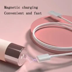 Base metálica do vibrador clitoriano Estilete recebendo o cabo de carga magnético USB