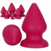 Plug anal cônico gigante de silicone vermelho com base ventosa ao lado dos seis tamanhos da linha