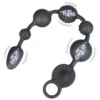 Cordão anal vibratório Vértebra em silicone preto, com seis esferas de diâmetros alternados e anel de puxar